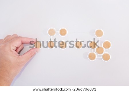 Business process and workflow automation with flowchart. Hand holding wooden cube block arranging processing management