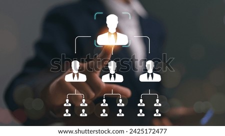 Business process and workflow automation with flowchart. Hierarchical structure of teams and employees in the company. Businessman touching organization chart on the virtual interface screen.
