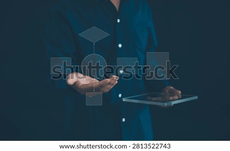 Business process workflow concept with a digital flowchart interface and tablet. Representing process management, workflow automation, strategic planning, decision making, and operational efficiency.