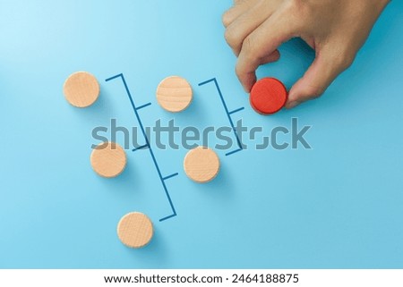Business process, Workflow, Flowchart, Process Concept with Businessman hand holding red wooden blocks on blue background