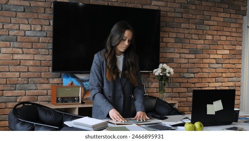 Business professional at conference reviewing material samples and discussing design strategies. Focused on collaboration and innovation, ensuring project alignment with client expectations. - Powered by Shutterstock
