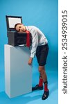 Business professional, employee, trainee falls asleep on top of copier, representing stress and burnout in modern office environment. Concept of business, corporate lifestyle, office, pop art, humor