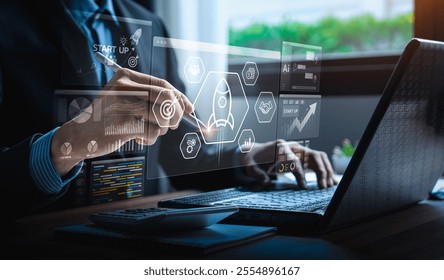 Business professional interacting with futuristic digital interface displaying startup analytics, market strategy, innovation icons for enhanced business growth, productivity, data-driven - Powered by Shutterstock