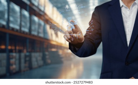 A business professional interacts with digital logistics icons in a warehouse setting, highlighting modern supply chain management and technology integration.