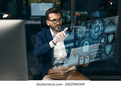 Business professional interacts with holographic interface, focusing on cybersecurity and digital data.