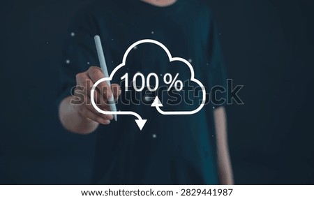 Business professional managing secure cloud backup and file synchronization with 100 percent completion, cloud storage, data transfer, digital backup, cybersecurity, and cloud computing.