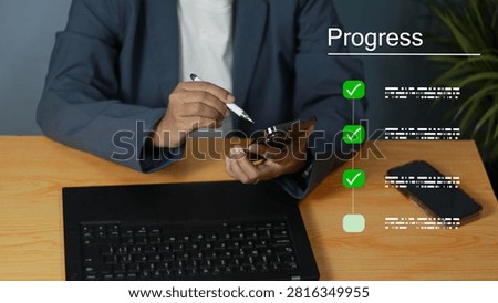 Business professional tracking progress and completing digital tasks on a smartphone, with checklist icons, laptop, and workspace representing productivity, project management, workflow, and successful goal achievement.