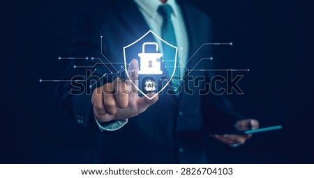 Business professional using AI-powered cybersecurity interface with digital shield and padlock. Concept of data protection, network security, privacy, risk management, encryption, secure technology.