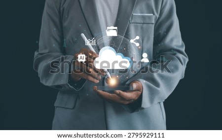 Business professional using cloud computing technology with AI, data analytics, file management, digital transformation, cybersecurity, and global network connectivity solutions.