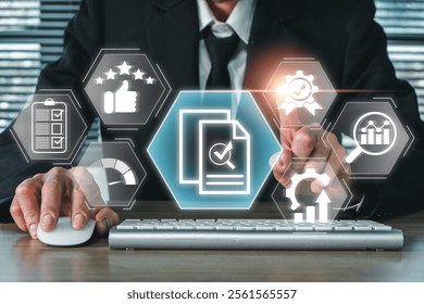 Business professional using digital interface with evaluation icons for data analysis and strategic planning.
