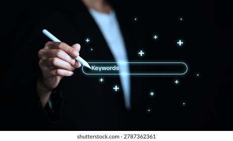 Business professional using digital interface for keyword research, SEO search optimization, content strategy and online marketing analysis with futuristic technology concept.