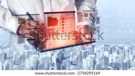 Business Professional Using Digital Tablet While Analyzing Data With Graphs and Charts Against Urban Cityscape Background Ledger.