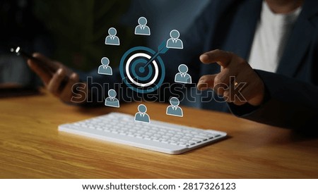 Business professional using digital technology to target ideal customers, visualize audience segmentation, and develop a focused marketing strategy for customer acquisition, sales growth, and business success.
