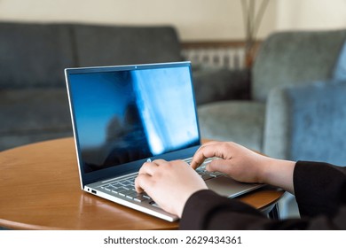Business Professional Working on Laptop in Café