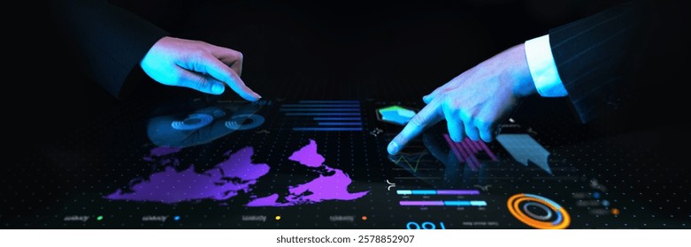 Business professionals collaborating over interactive digital table with global financial data, charts, and futuristic blue interface against dark background. Concept of business, data, engineering.