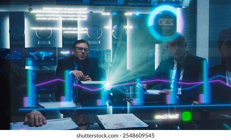 Business Professionals in a Meeting Room Analyze Financial Data Holograph Projected on Screen. Diverse Team Collaborates on Strategic Planning Using Digital Analytics, Charts, Graphis, Growth Visuals - Powered by Shutterstock