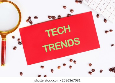 Business, programming, interface, application and network concept. Text TECH TRENDS on the red card, top view.