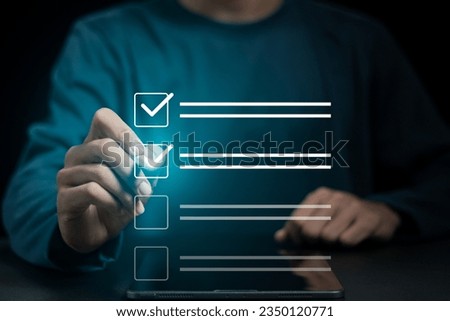 Business project approval concept,  businessman using a pen to mark the correct checkboxes.