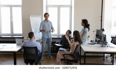 Business project startup leader in informal clothes presenting sales results on white board, giving t workshop, speaking to employees on corporate meeting, training staff. Presentation concept - Powered by Shutterstock