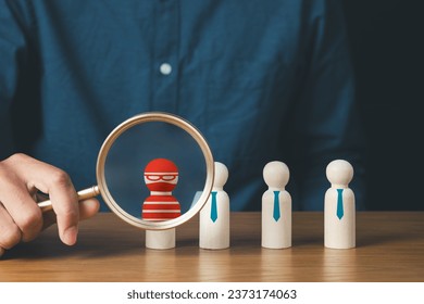 business protection, cybersecurity, cybercrime and hacker concept.businessman holding magnifier and searching wooden of thief hacker in business team.