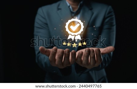 Business Quality Achievement and Excellence Concept. Businessman showcases a glowing five-star rating and award badge, symbolizing high quality and excellence in business.