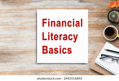 Business quotes, Financial Literacy Basics on notebooks or paper in office desk, office workplace