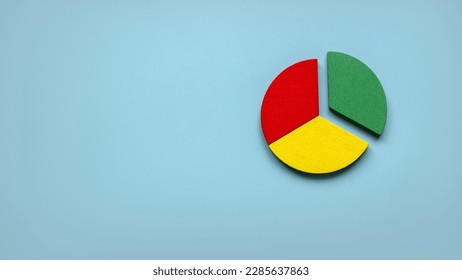 Business report concept.Company financial report.Business charts. Colorful quarter wooden pie chart pieces . Banner with copy space.