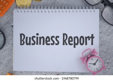 Business Report Wording With Clock, Calculator, Scrapped Paper And Colorful Pencil Over Grudge Background. Selective Focus Image