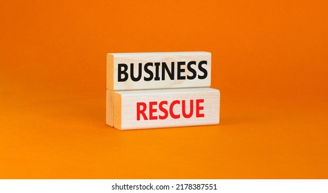 Business Rescue Symbol. Concept Words Business Rescue On Wooden Blocks On A Beautiful Orange Table Orange Background. Business Rescue And Support Concept. Copy Space.