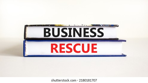 Business Rescue Symbol. Concept Words Business Rescue On Books On A Beautiful White Table White Background. Business Rescue And Support Concept. Copy Space.