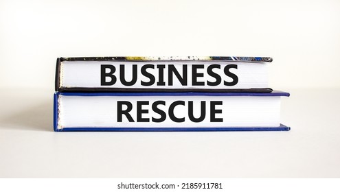 Business Rescue Symbol. Concept Words Business Rescue On Books On A Beautiful White Table White Background. Business Rescue And Support Concept. Copy Space.