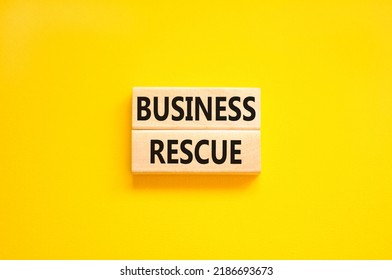 Business Rescue Symbol. Concept Words Business Rescue On Wooden Blocks On A Beautiful Yellow Table Yellow Background. Business Rescue And Support Concept. Copy Space.