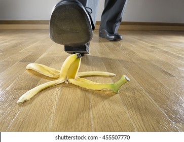 Business risk concept: Man to step on banana skin. 