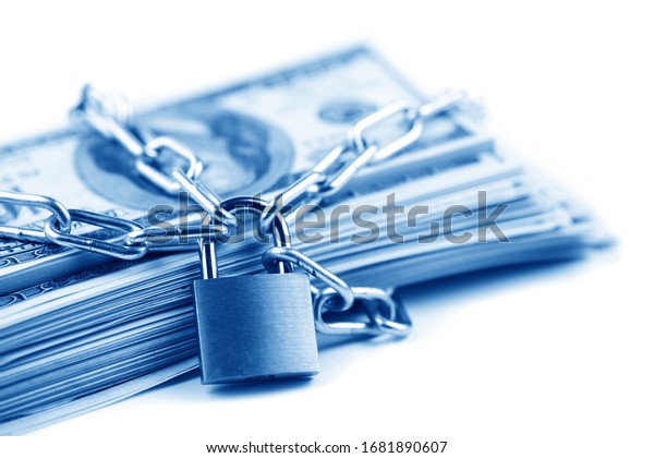 Business safety\
or financial protection or restriction access. Heap of money in\
chain with padlock isolated on\
white