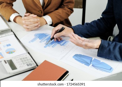 Business sales consultant discussing in data documents at modern office 