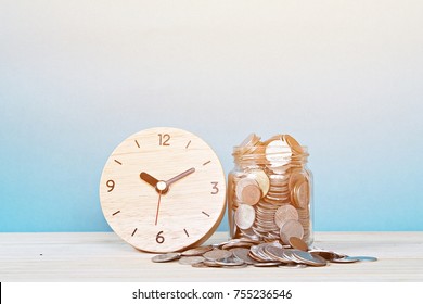Business, savings time, time is money, deadline or delay concept : wooden alarm clock and coins on white background