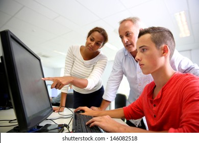 Business School Students In Class With Teacher