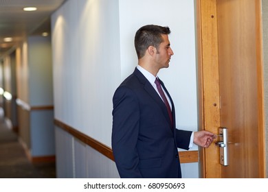 Business, Security And People Concept - Businessman With Keycard At Hotel Room Or Office Door