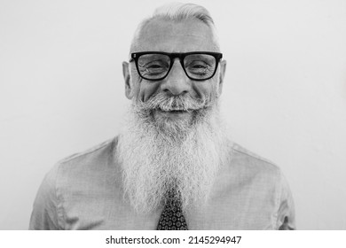 Business senior hipster man smiling on camera - Focus on face - Black and white editing