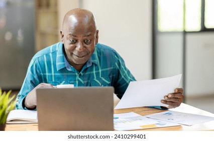 Business senior man 60 years old using laptop computer  coffee cup in office. Happy middle aged man, entrepreneur, small business owner working online. - Powered by Shutterstock