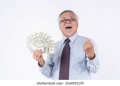 Business Senior Rich Man Asian Senior Man , Old Man ,holding Money US Dollar Bills In Hand On White Background , Senior Success Business Concept  