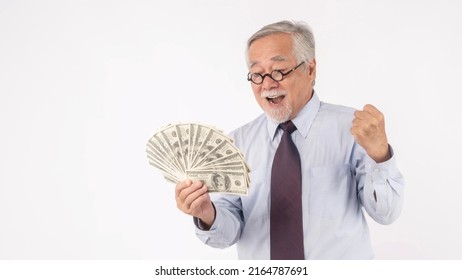 Business Senior Rich Man Asian Senior Man , Old Man ,holding Money US Dollar Bills In Hand On White Background , Senior Success Business Concept  