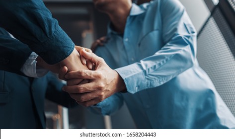 Business shaking hands, finishing up meeting. Successful businessmen handshaking after good deal. - Shutterstock ID 1658204443