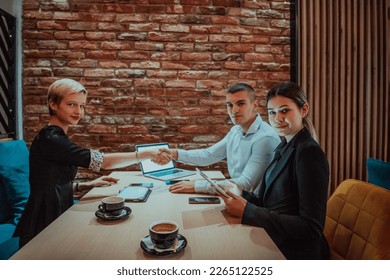 Business shaking hands, finishing up meeting. Successful businesspeople handshaking after good deal - Powered by Shutterstock