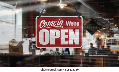 A business sign that says 'Come in We're Open' on Cafe / Restaurant window. - Shutterstock ID 516415369