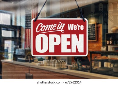 A Business Sign That Says ‘Come In We’re Open’ On Cafe/restaurant Window.