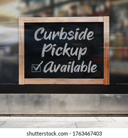 A Business Sign That Says ‘Curbside Pickup Available’ On The Window.