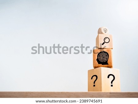 Business solution, creativity, idea plan process, problem solving process concepts. Light bulb icon, magnifier, maze, question mark symbol on wooden cube blocks stack on white background with space.