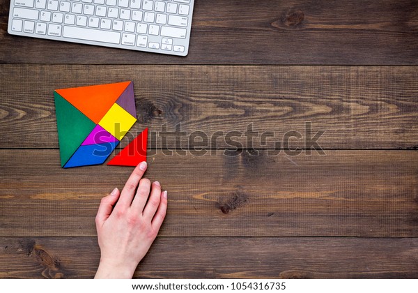 Business\
solutions, success and strategy. Puzzle with paper pieces office\
desk rustic background top view\
mock-up