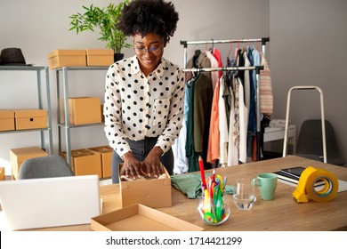 Business Start up SME concept. Young startup entrepreneur small business owner working at home, packaging and delivery situation. Women, owener of small business packing product in boxes